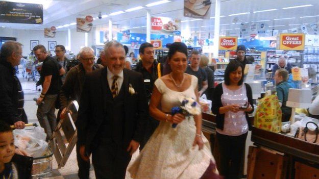 Rebecca and Blake check out of Morrisons.