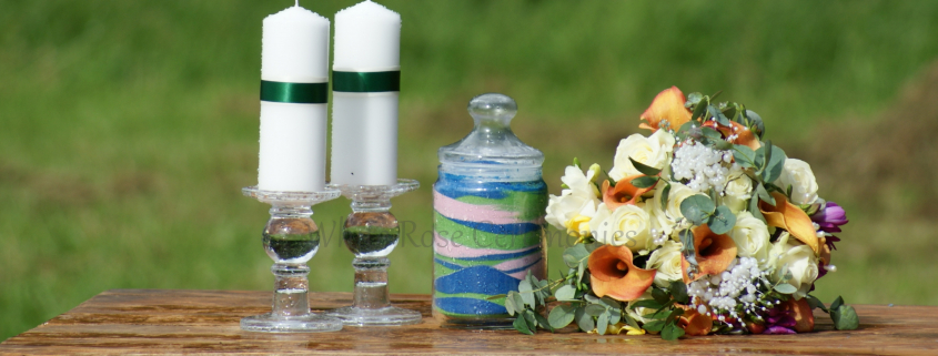 Sand Unity Ceremony jar with candles and flowers