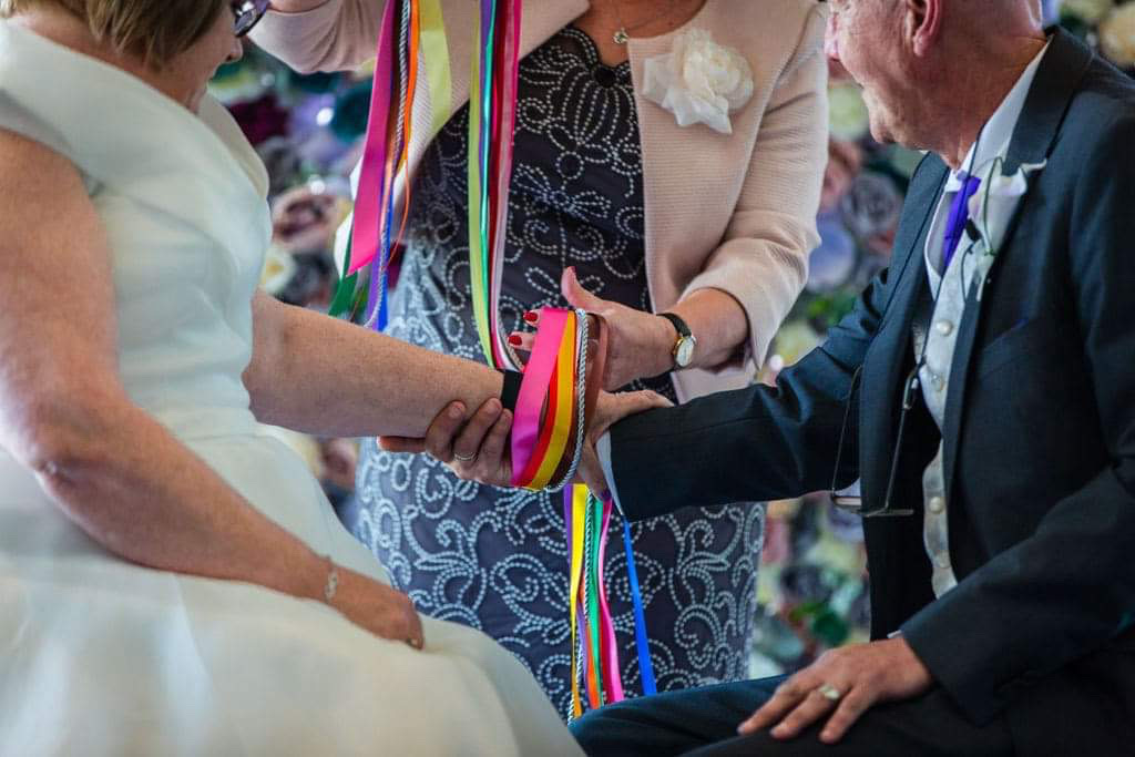 Include different coloured ribbons in a hand tying to remember loved ones