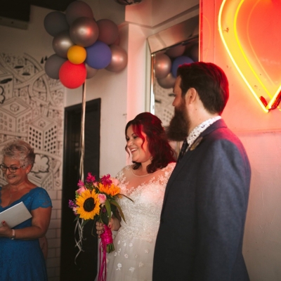 Bride and groom smile during their ceremony