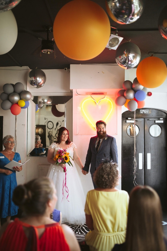 Micro Wedding Bride and groom face their guests